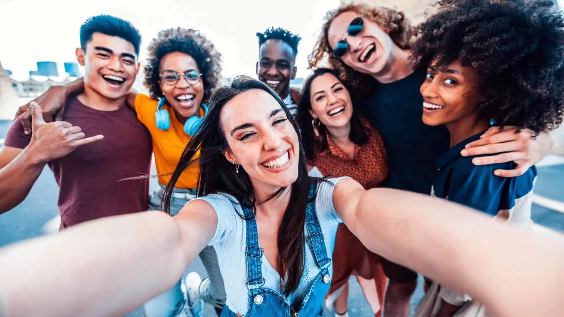 A group of friends smiling together for a selfie